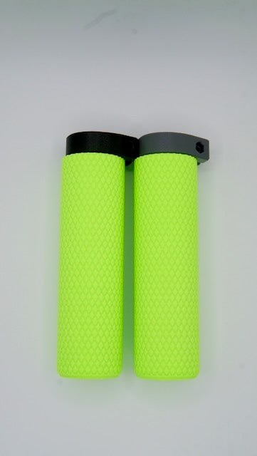 Two MTB Air Grips - Green Monstah! with a bright green textured design and black and gray clamps are placed side by side on a light background.
